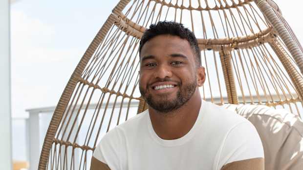 Tua Tagovailoa models brown and white Perry Ellis clothing.